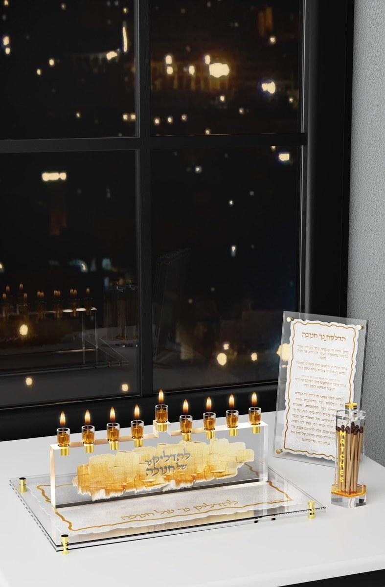 Feldart menorah on a decorative tray beside a brachos card
